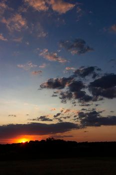 Backlit sunset with yellow, red and blue colors in southern Andalusia, Spain