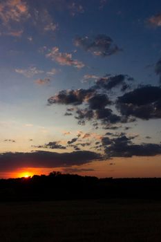 Backlit sunset with yellow, red and blue colors in southern Andalusia, Spain