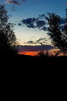 Backlit sunset with yellow, red and blue colors in southern Andalusia, Spain