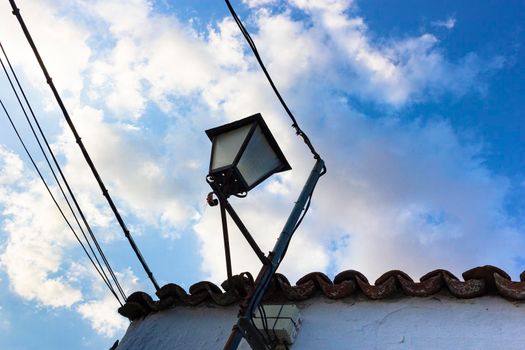 Lantern on a wall of a village in Andalusia southern Spain