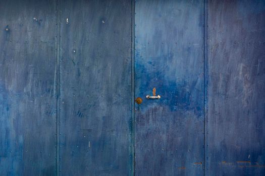 Metal of a metal door, weathered in southern Andalusia, Spain