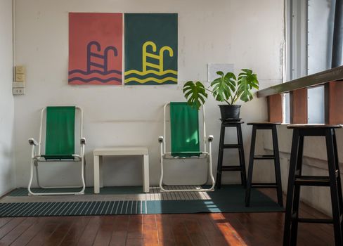 Bangkok, Thailand - 19 Dec, 2019 : Leisure area or living area on a balcony in home or apartment with wooden table and chairs. No focus, specifically.