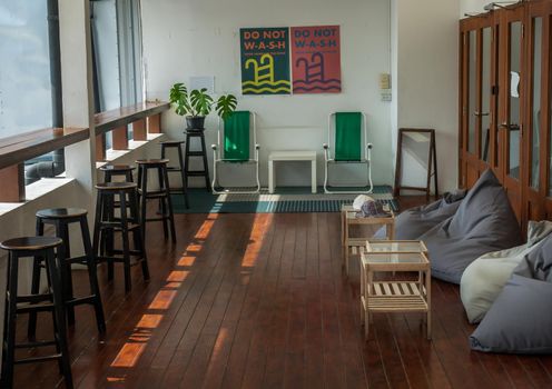 Bangkok, Thailand - 19 Dec, 2019 : Leisure area or living area on a balcony in home or apartment with wooden table and chairs. No focus, specifically.
