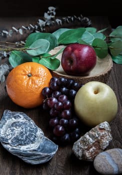 Variety of fresh assorted fruits on the old wooden table. Assorted fruits colorful background, healthy fruits, Dark tone, Selective focus.