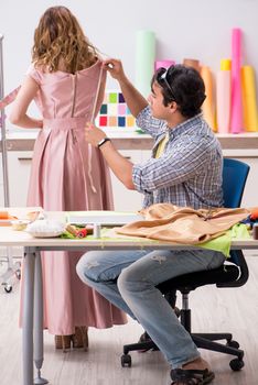 Young tailor working in his workshop
