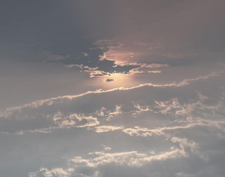Beautiful sunset sky above clouds with dramatic light. Beautiful blazing sunset landscape, Horizon. Warm Colours, copy space, No focus, specifically.