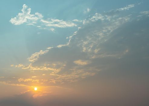 Beautiful sunset sky above clouds with dramatic light. Beautiful blazing sunset landscape, Horizon. Warm Colours, copy space, No focus, specifically.