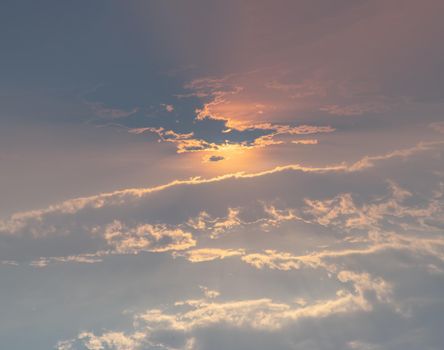 Beautiful sunset sky above clouds with dramatic light. Beautiful blazing sunset landscape, Horizon. Warm Colours, copy space, No focus, specifically.
