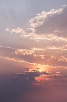 Beautiful sunset sky above clouds with dramatic light. Beautiful blazing sunset landscape, Horizon. Warm Colours, copy space, No focus, specifically.