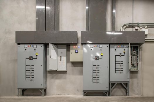 Electric voltage control room cabinets of condominium. Selective focus.