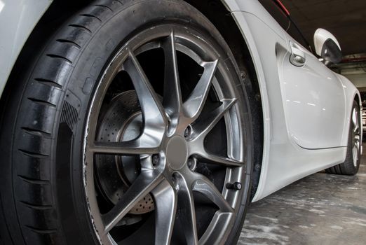 Close-up of Wheel of White Sports Car. Selective focus.