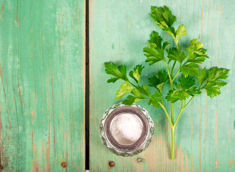 Fresh green parsley on wooden old background