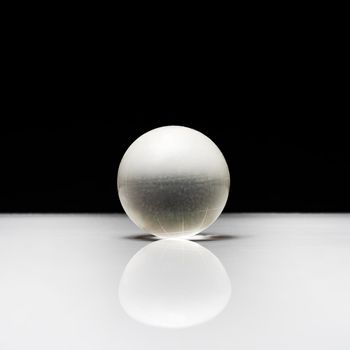 a glass globe on a white surface