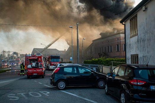 VILLANOVA DEL GHEBBO, ITALY 23 MARCH 2021: Fire house firefighters smoke