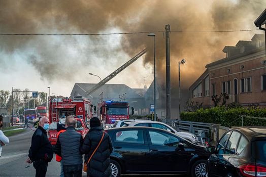 VILLANOVA DEL GHEBBO, ITALY 23 MARCH 2021: Fire house firefighters smoke