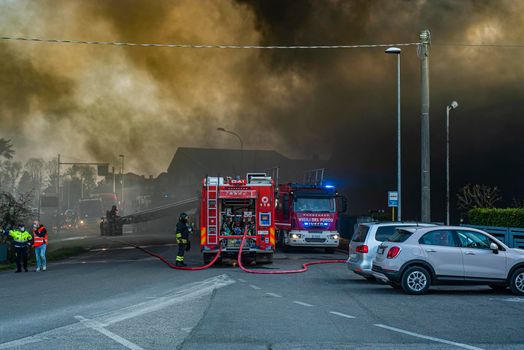 VILLANOVA DEL GHEBBO, ITALY 23 MARCH 2021: Fire house firefighters and smoke