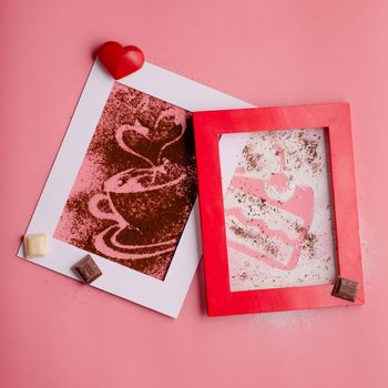 photo frame with heart and coffee silhouette from coffee and powdered sugar on pink background