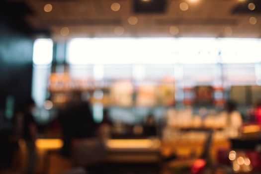 Close up abstract blurred people in food center