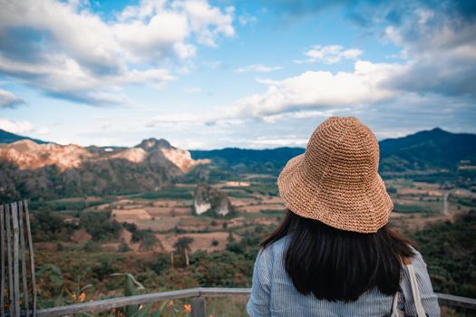 Woman standing on Phu Lang Ka, Phayao in Thailand.