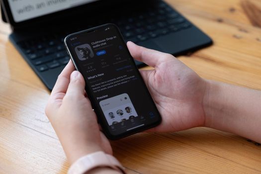 CHIANG MAI,THAILAND - MAR 21, 2021 : Clubhouse application view on the iPhone, controversy 2021 that hides behind the Social app. Clubhouse drop in audio chat application view on the iPhone