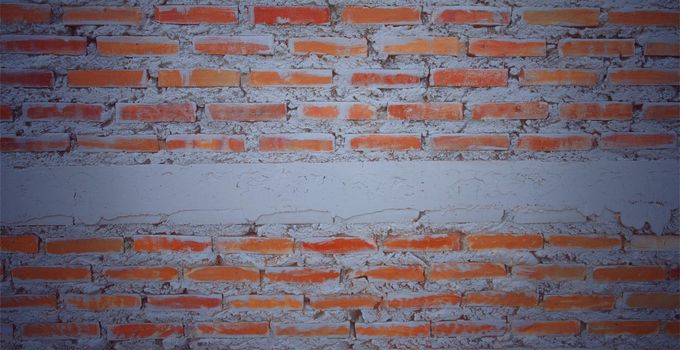 Vintage image old empty brick wall painted texture distressed red-brown wall wide grunge brick wall shabby building with damaged plaster abstract web banner white copy space across