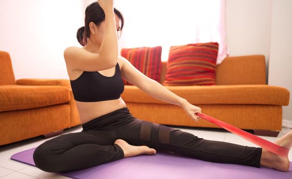 A woman in black is losing weight on her morning exercise tire.