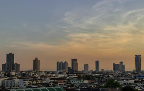 Bangkok, Thailand - Dec 28, 2020 : Aerial view of Beautiful scenery view of Skyscraper Evening time before Sunset creates relaxing feeling for the rest of the day. Selective focus.