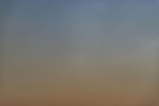 Background of blue and orange sky and empty space for your design. No cloud, No focus, specifically.