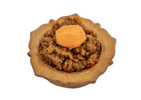 Thai style food : Stir-Fried Pork Crackle with Curry Paste (Fried ginger pork with salted duck egg) isolated on white background with clipping path. Selective focus.