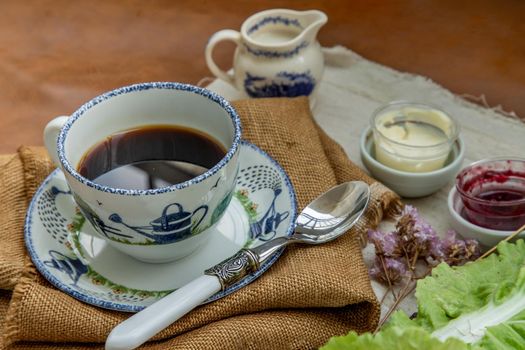 Black coffee with milk on sack cloth for new morning. Rrefreshing, Selective focuse.
