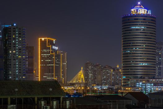 Bangkok, Thailand - 05 Apr 2020 : Bangkok downtown at night view in the business district, Beautiful twilight give the city a modern style, Selective focus.