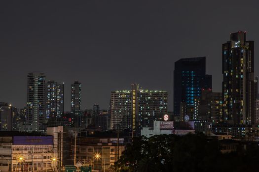 Bangkok, Thailand - 05 Apr 2020 : Bangkok downtown at night view in the business district, Beautiful twilight give the city a modern style, Selective focus.