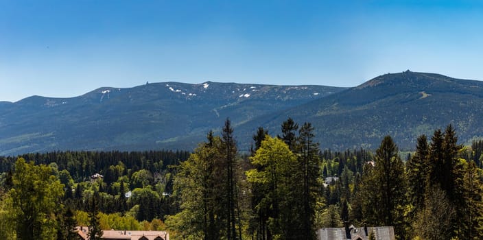 Panorama of Karkonosze Giant Mountains over trees in Szklarska Poreba