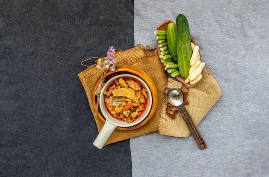 Thai style food : Panaeng Curry with Pork menu with Coconut milk (Dried red pork coconut curry) Served with vegetable. Delicious and famous Thailand food. Top view.