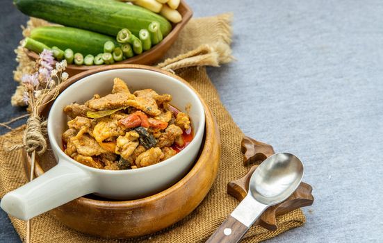 Thai style food : Panaeng Curry with Pork menu with Coconut milk (Dried red pork coconut curry) Served with vegetable. Delicious and famous Thailand food.
