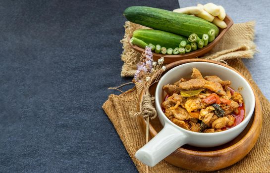 Thai style food : Panaeng Curry with Pork menu with Coconut milk (Dried red pork coconut curry) Served with vegetable. Delicious and famous Thailand food.