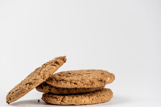 Dry biscuit cookies from the package lies on a white sheet of paper