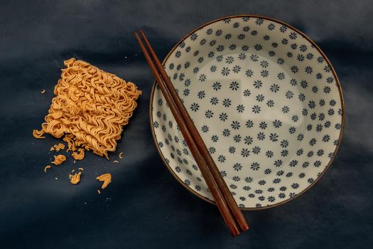 Easy food, Dried instant noodles and hot water in a bowl.