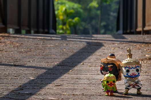 Bangkok, Thailand - Nov 18, 2019 : Ravana, Giantess and Hanuman Walking on the bridge in the park. Traveller doll. No focus, specifically.