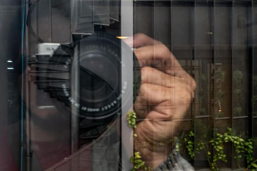 View reflection In mirror while photographing. Camera lens close-up background. No focus, specifically.