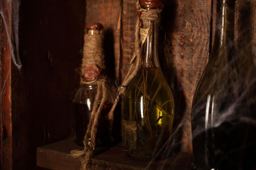 Halloween background Shelves with alchemy tools Skull spiderweb bottle with poison candles Witcher workspace Scarry room