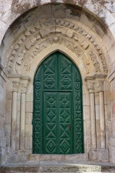 green colored door of a church in Galicia in Spain