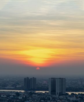 Bangkok, Thailand - Jan 10, 2021 : Aerial view of Amazing beautiful scenery view of Bangkok City skyline and skyscraper before sun setting creates relaxing feeling for the rest of the day. Evening time, Selective focus.