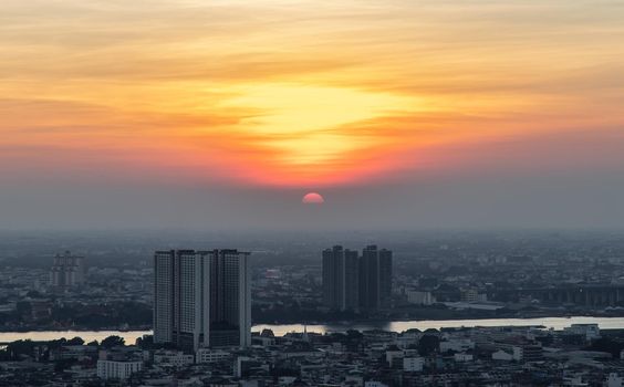 Bangkok, Thailand - Jan 10, 2021 : Aerial view of Amazing beautiful scenery view of Bangkok City skyline and skyscraper before sun setting creates relaxing feeling for the rest of the day. Evening time, Selective focus.