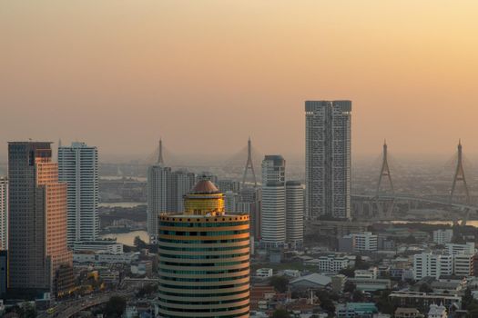 Bangkok, Thailand - Jan 12, 2021 : Aerial view of Beautiful scenery view of Skyscraper Evening time before Sunset creates relaxing feeling for the rest of the day. Selective focus.