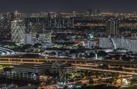 Bangkok, thailand - Aug 28, 2020 : Aerial view of Bang Sue central station with skyscrapers background at night. Selective focus.