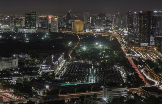 Bangkok, thailand - Aug 28, 2020 : Aerial view of Bang Sue central station with skyscrapers background at night. Selective focus.