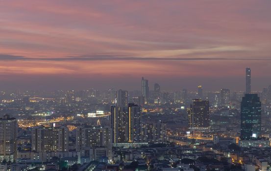 Bangkok, thailand - Dec 23, 2020 : Bangkok downtown cityscape in Business district with bright glowing lights at night give the city a modern style. No focus, specifically.