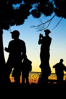 People watching the sunset in a viewpoint of Lisbon in Autumn