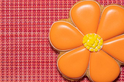 ginger cookies in the form of a flower on a red background. High quality photo